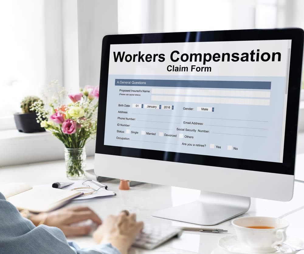 Workers' Compensation Claim Form and Insurance Concept.