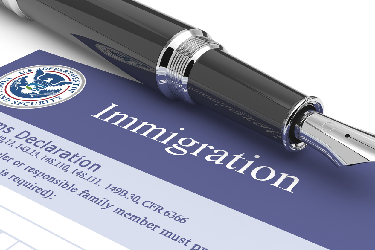 Immigration form with pen