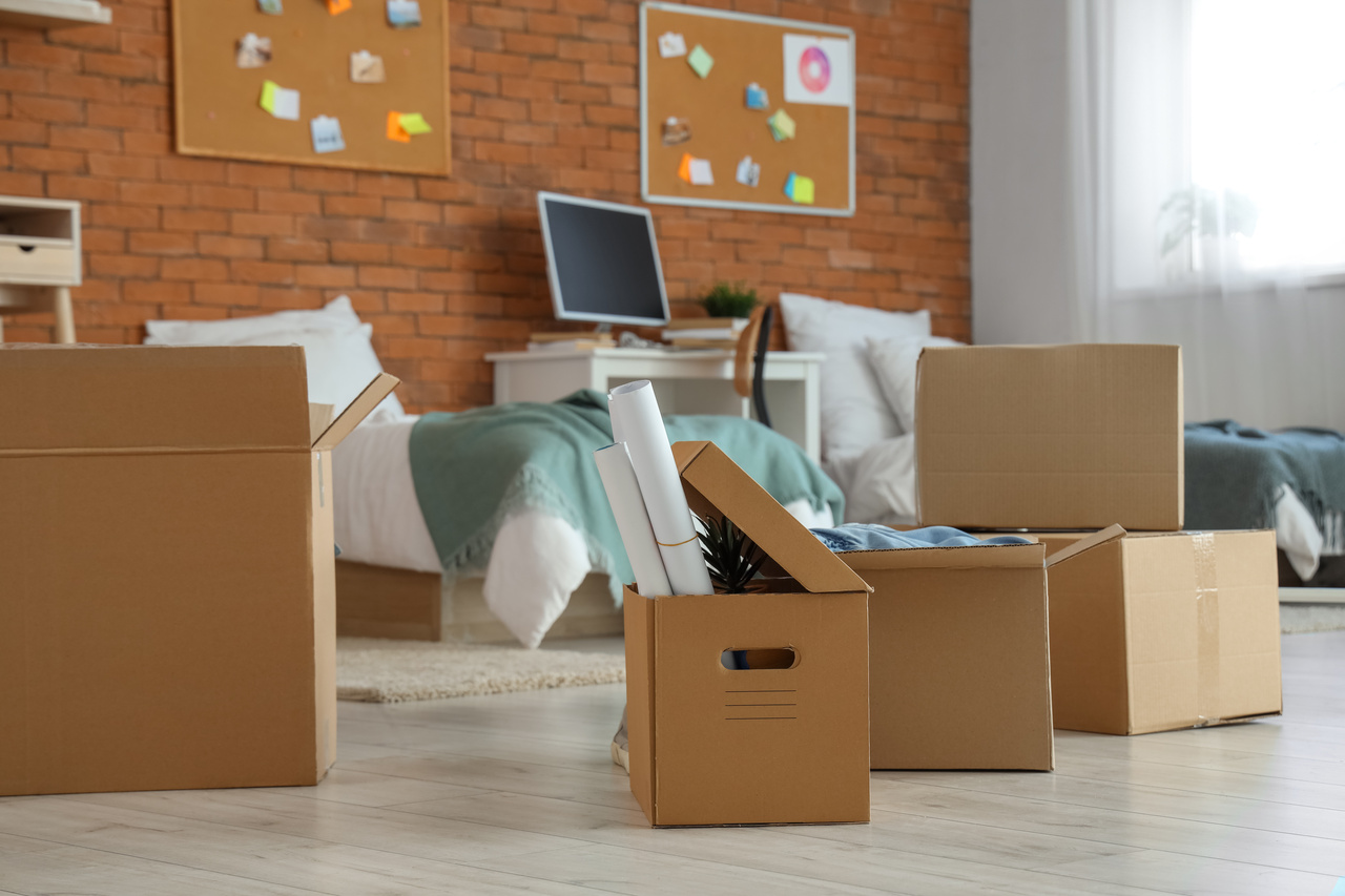 Cardboard boxes in dorm room on moving day